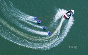 speedboat and tubers